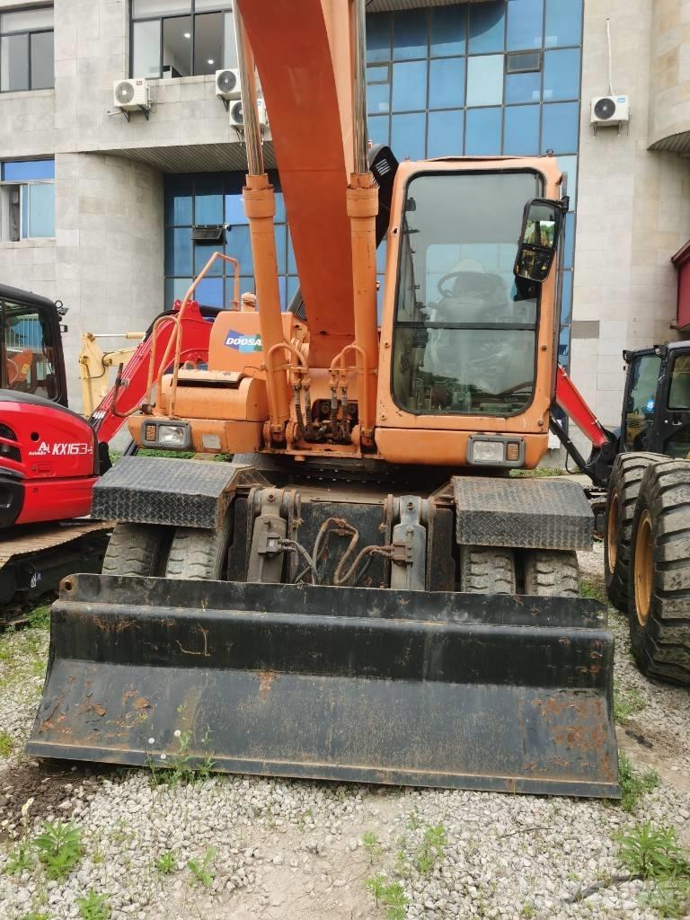 Doosan DH 210 W-7 حفارات بعجل