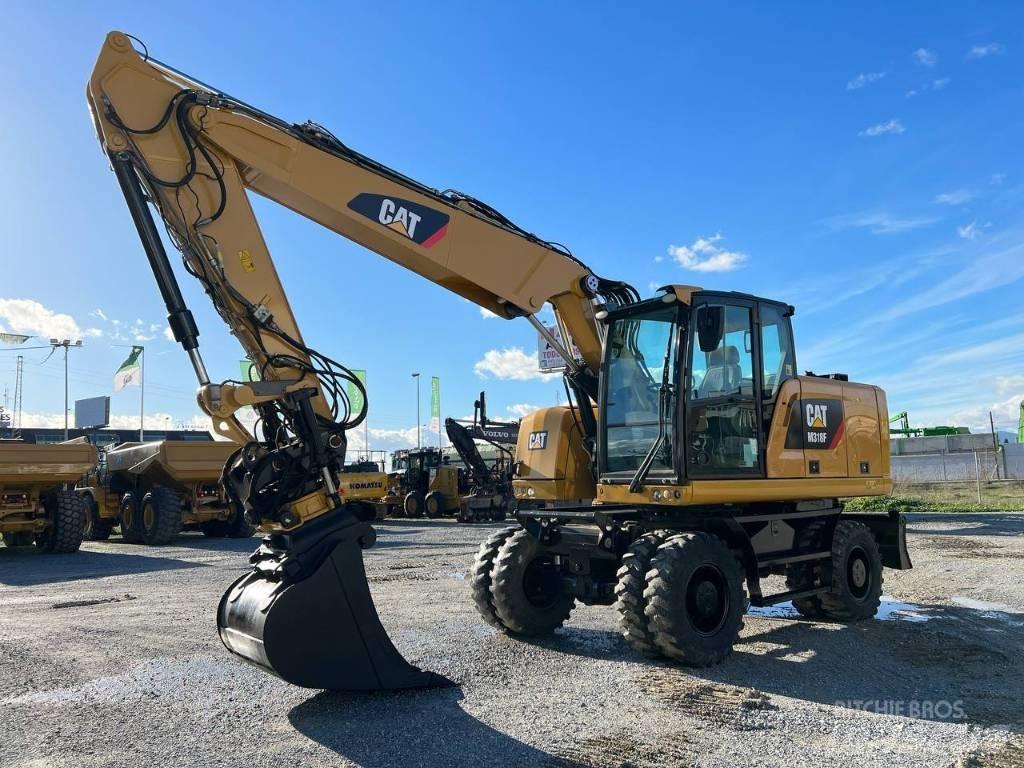 CAT M 318 F حفارات بعجل