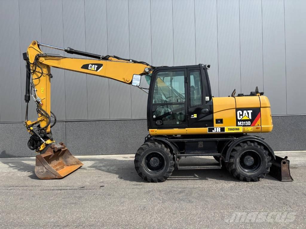 CAT M 313 D حفارات بعجل