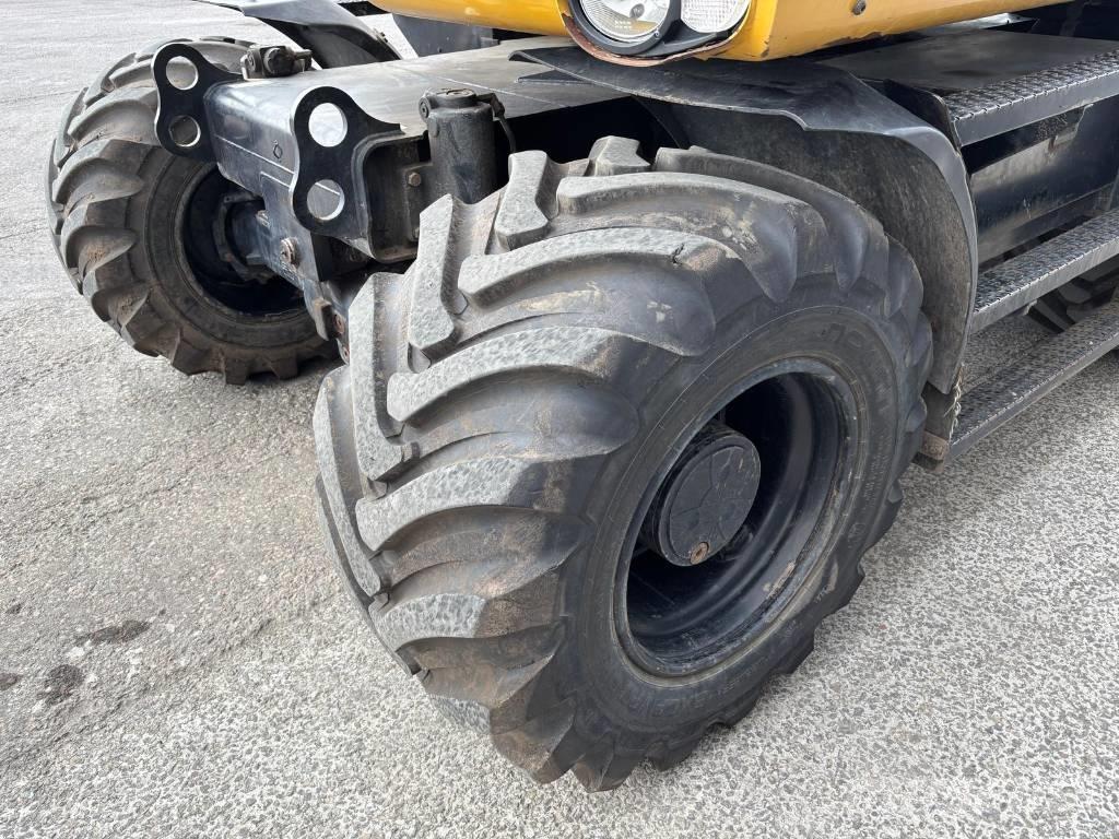 CAT M 313 D حفارات بعجل