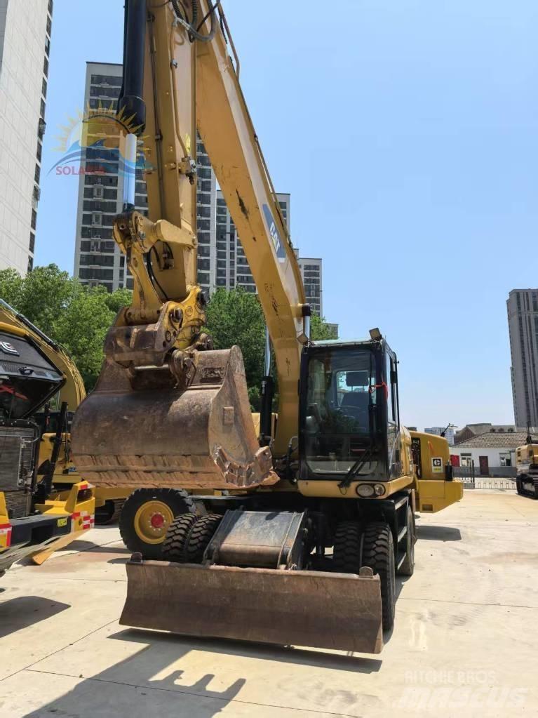 CAT M 315 D2 حفارات بعجل