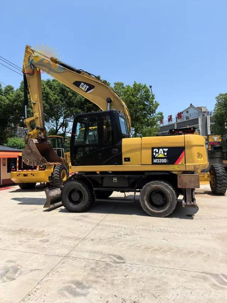 CAT M 315 D2 حفارات بعجل