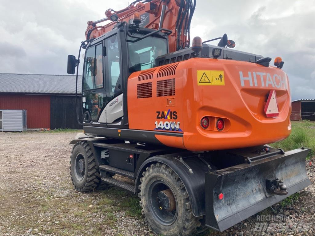 Hitachi 140w حفارات بعجل
