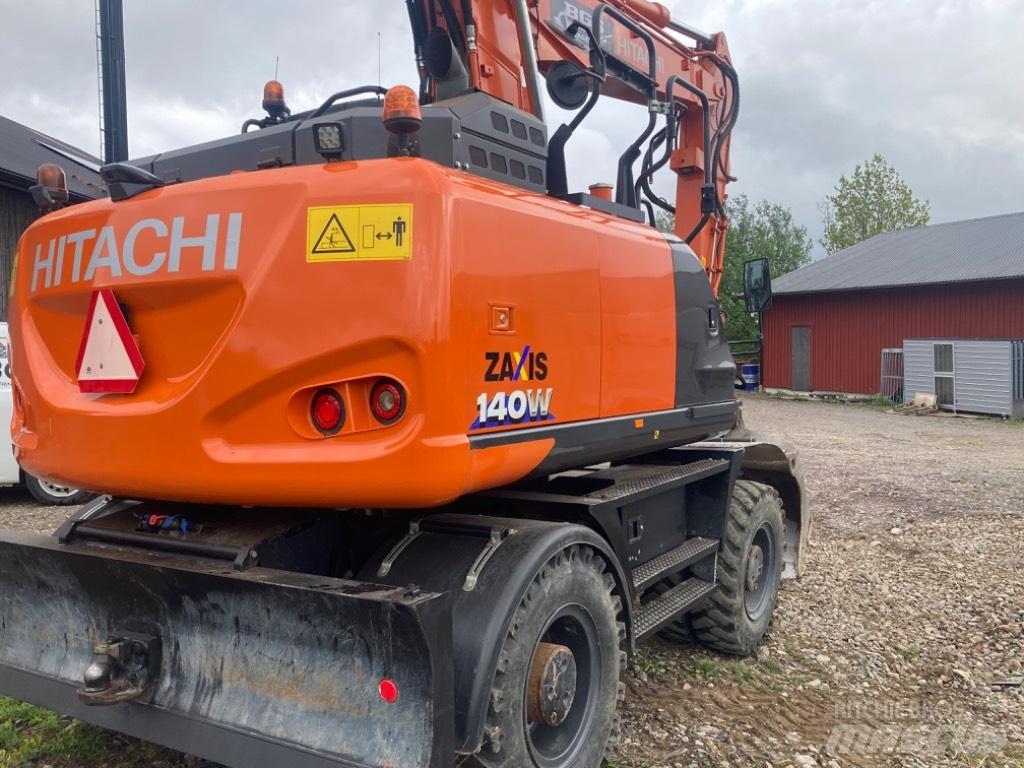 Hitachi 140w حفارات بعجل