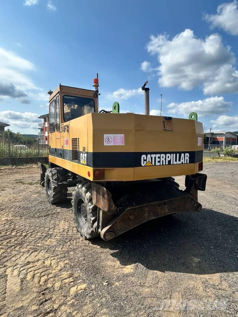 CAT 214 حفارات بعجل