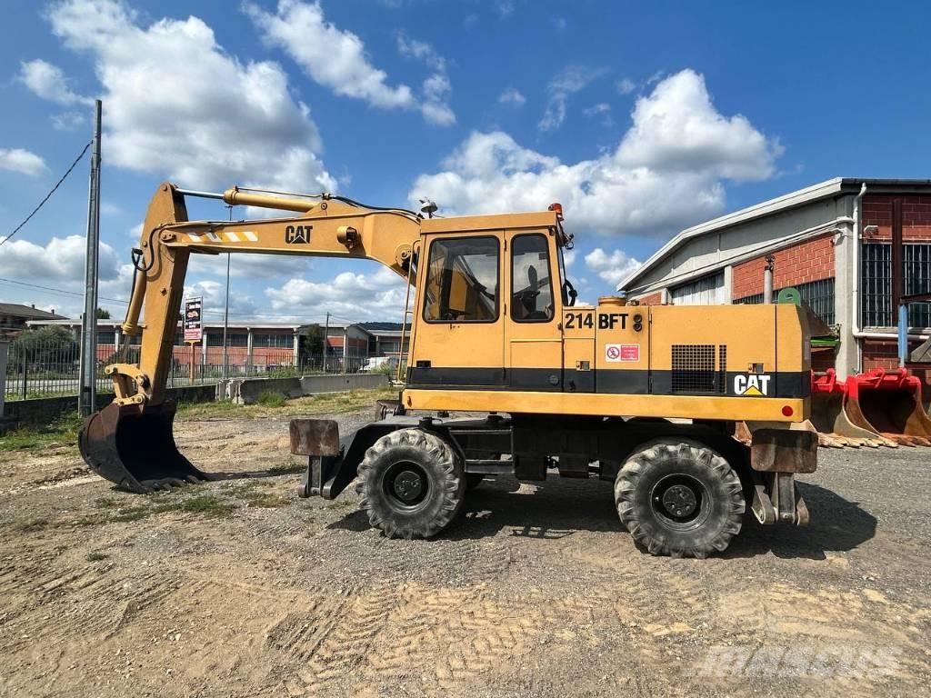 CAT 214 حفارات بعجل