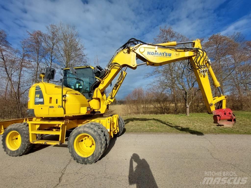 Komatsu PW 118 MR -8 حفارات بعجل