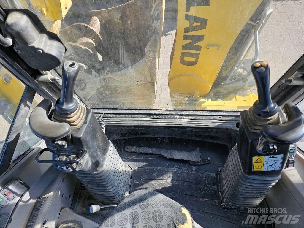 New Holland B 110 C لوادر ذات جرافات عكسية
