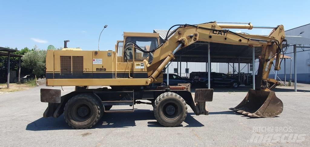 CAT 214 B حفارات بعجل