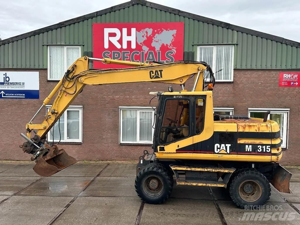 CAT M315 +ROTO CE حفارات بعجل