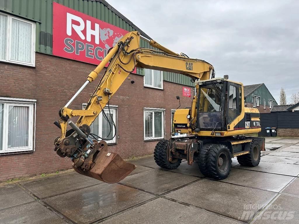 CAT M315 +ROTO CE حفارات بعجل