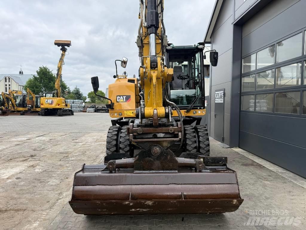 CAT M 318 F حفارات بعجل