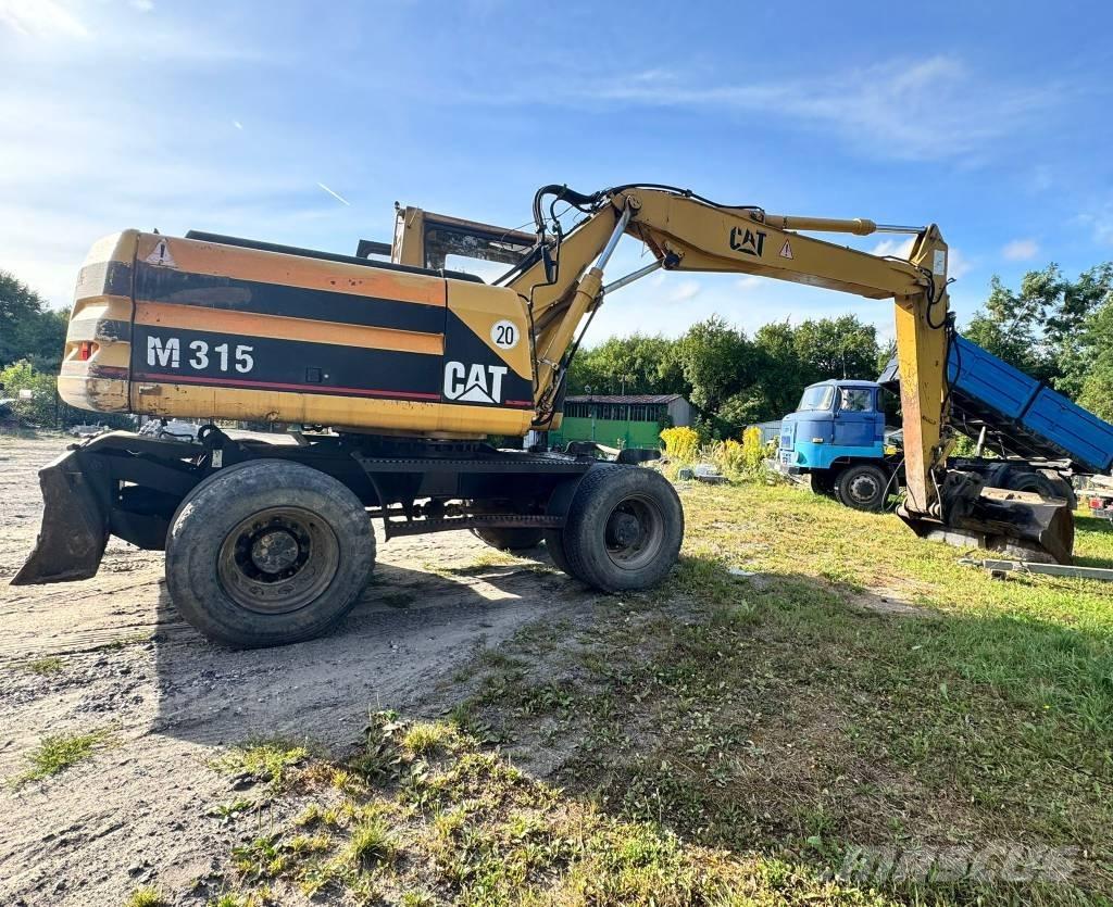 CAT M 315 حفارات بعجل