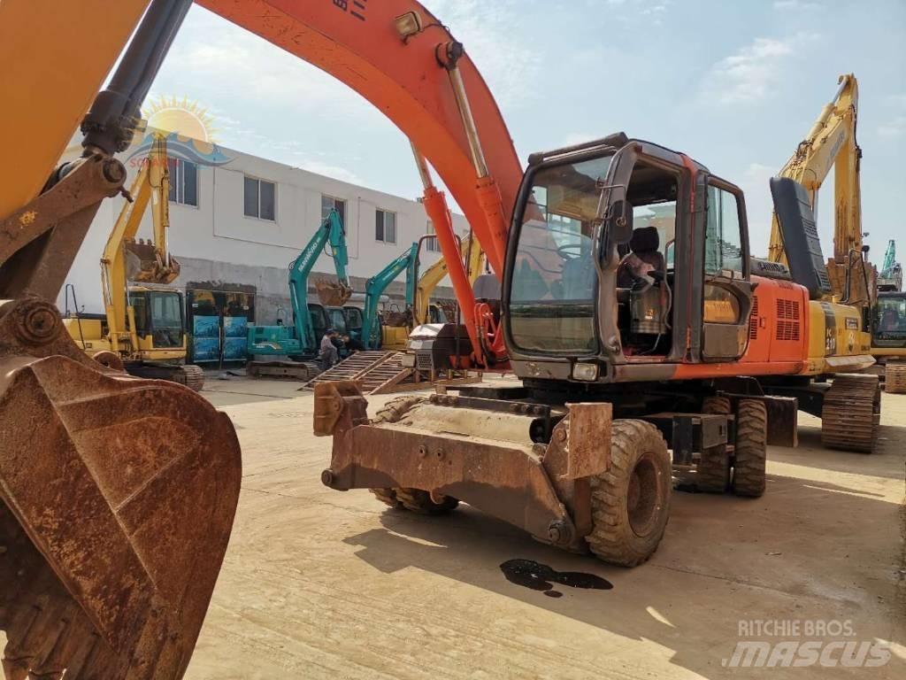 Hitachi ZX 210 W حفارات بعجل