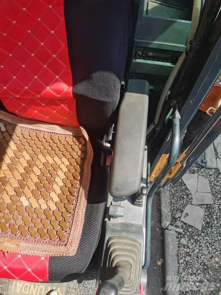 Hyundi 210w-9 حفارات بعجل