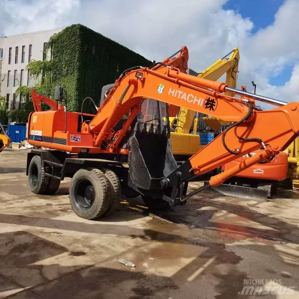 Hitachi EX 100 W D حفارات بعجل