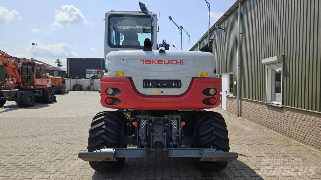 Takeuchi TB295W حفارات بعجل