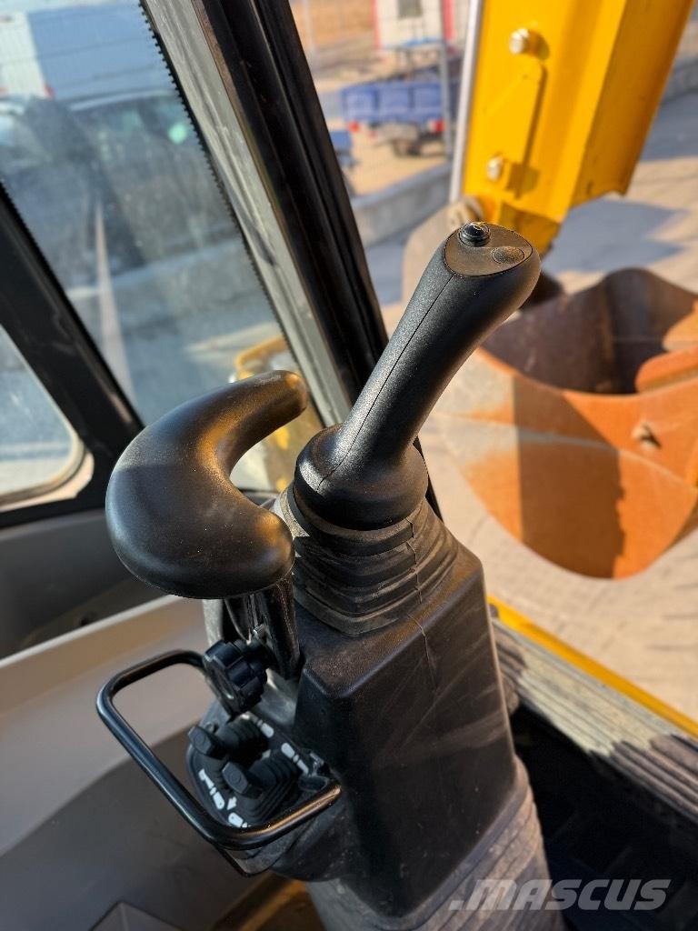 New Holland B 115 لوادر ذات جرافات عكسية