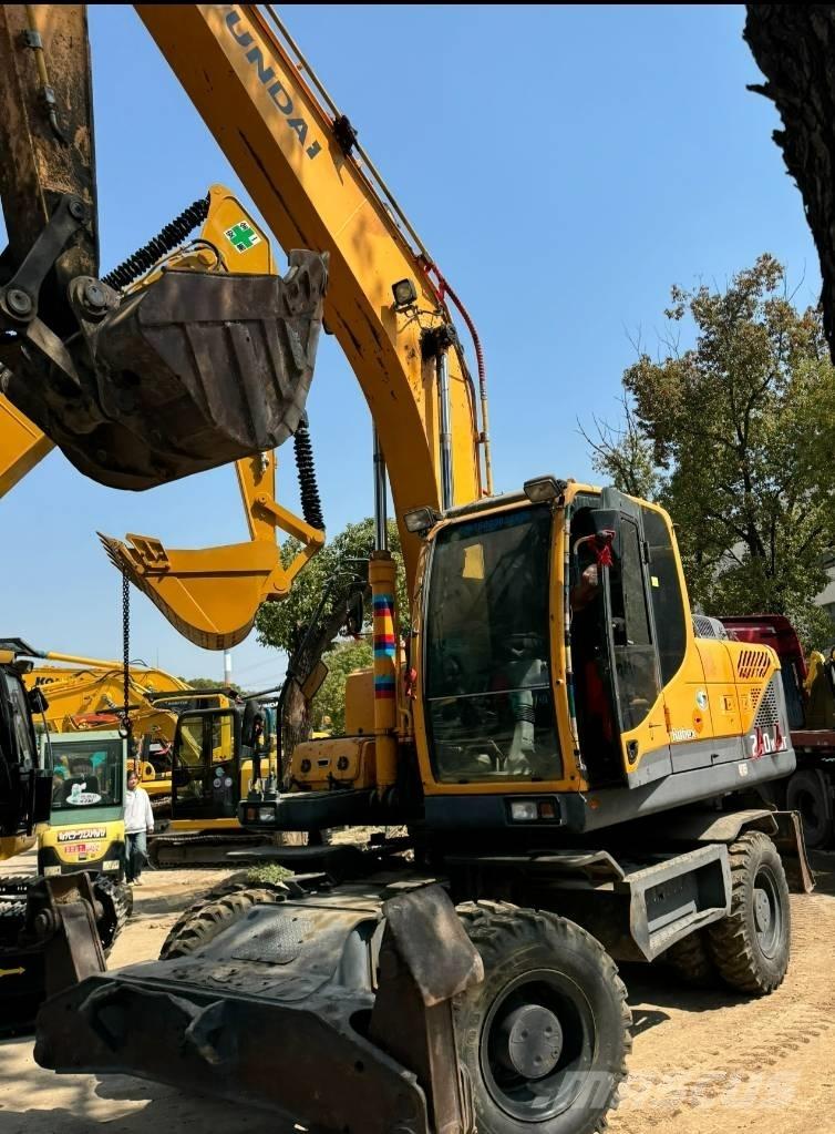 Hyundai 210W-9 حفارات بعجل