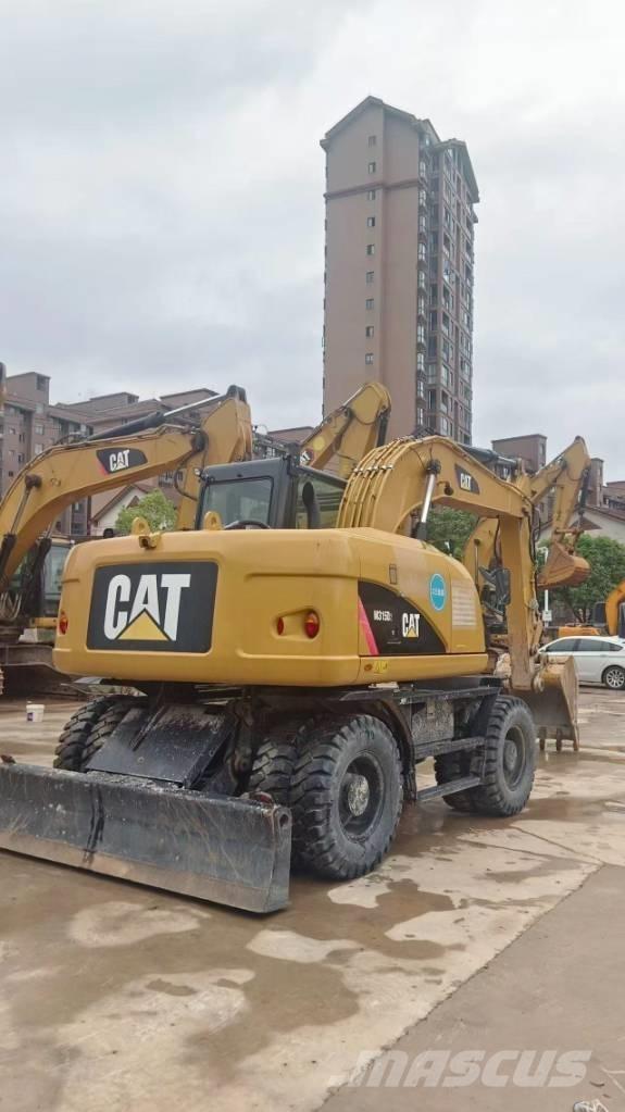CAT M 315 D حفارات بعجل
