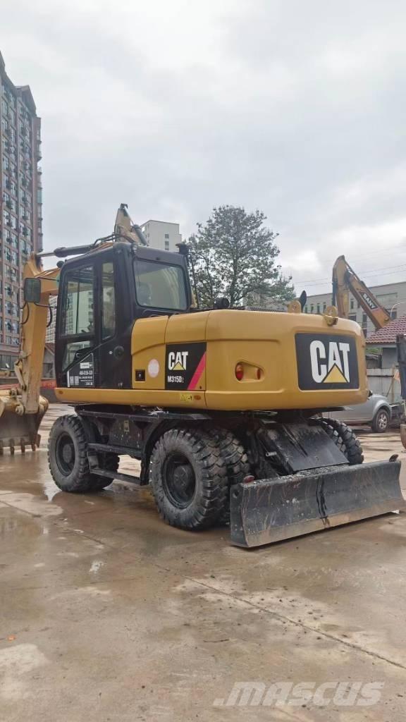 CAT M 315 D حفارات بعجل