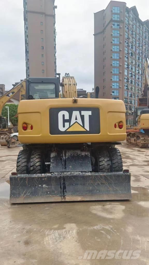 CAT M 315 D حفارات بعجل