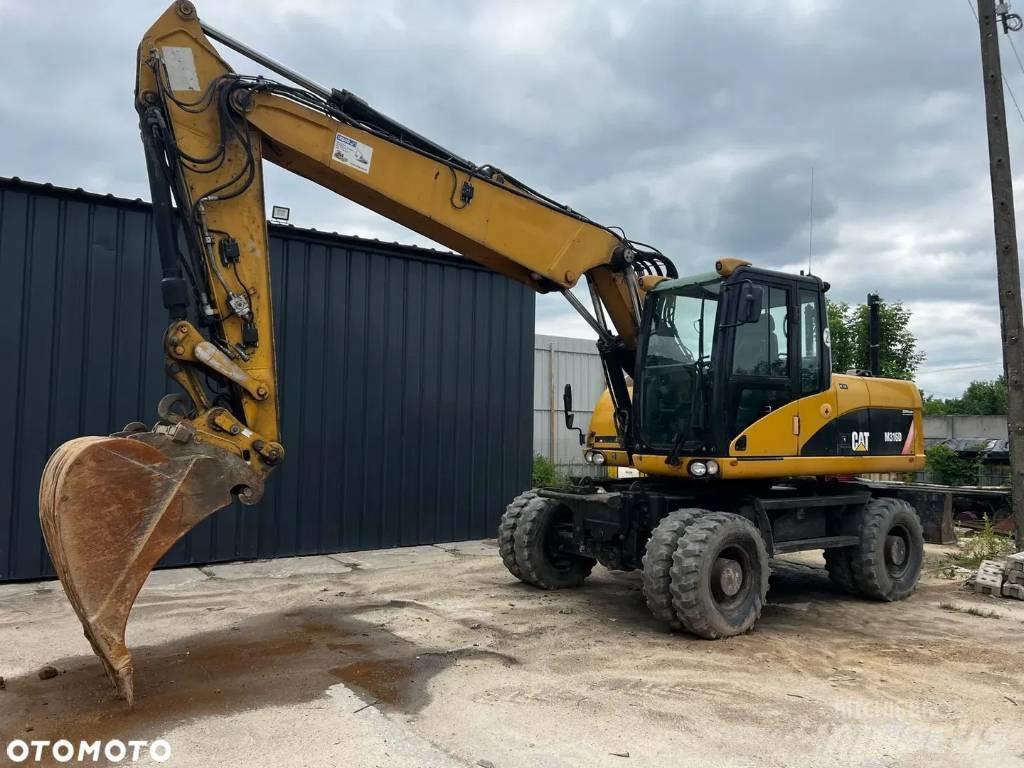 CAT M 316 D حفارات بعجل