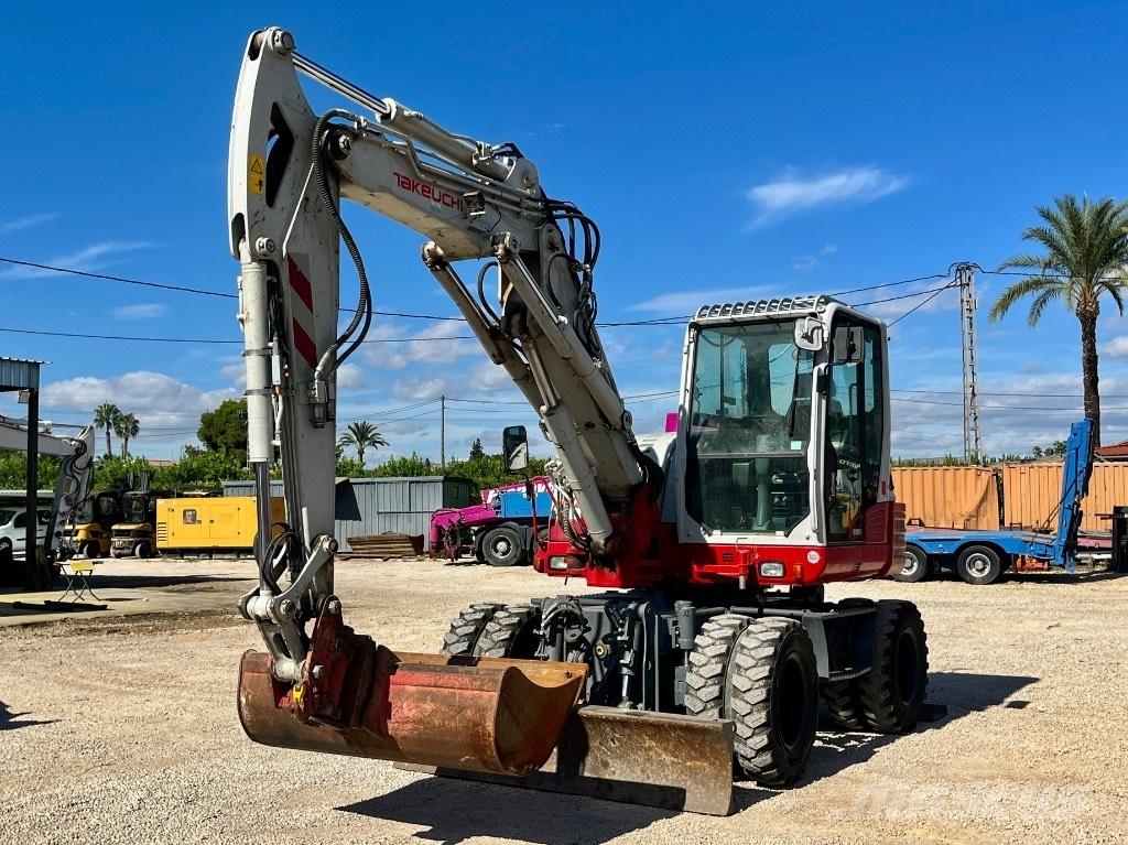 Takeuchi TB 295 W حفارات بعجل