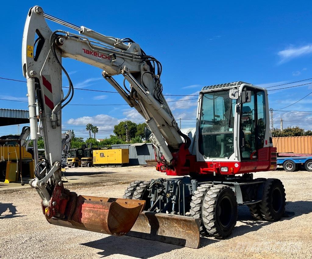 Takeuchi TB 295 W حفارات بعجل
