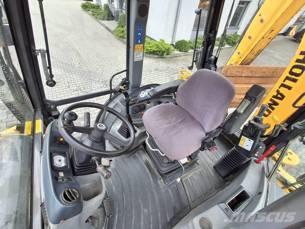 New Holland B 115 C لوادر ذات جرافات عكسية