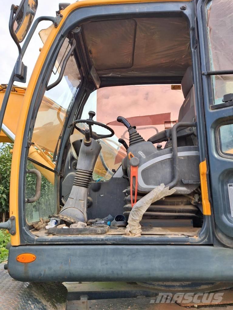 Hyundai Robex 140 W حفارات بعجل