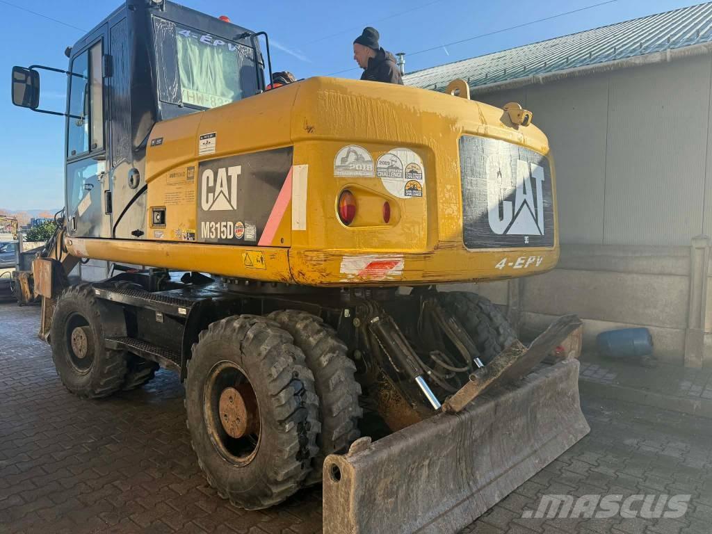 CAT M 315 D حفارات بعجل