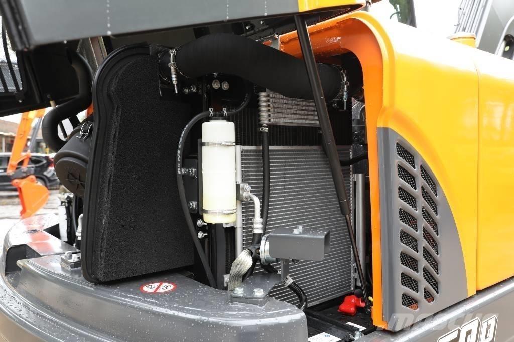 Develon DX 60 D حفارات بعجل