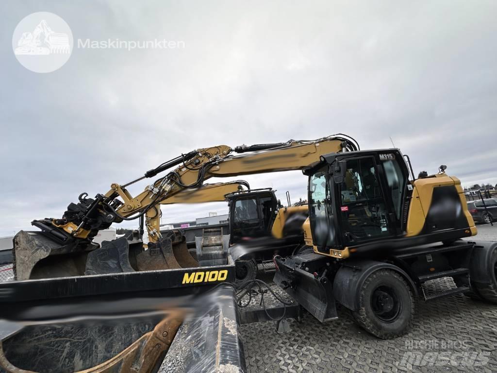 CAT M 315 حفارات بعجل