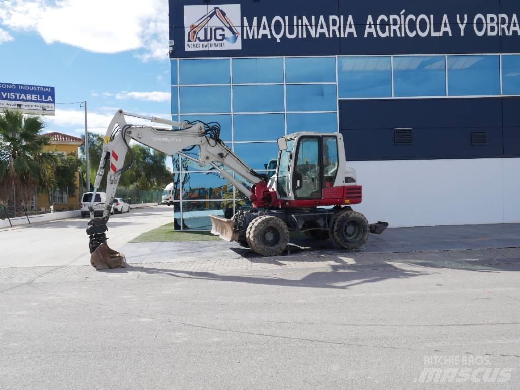 Takeuchi TB 295 W حفارات بعجل