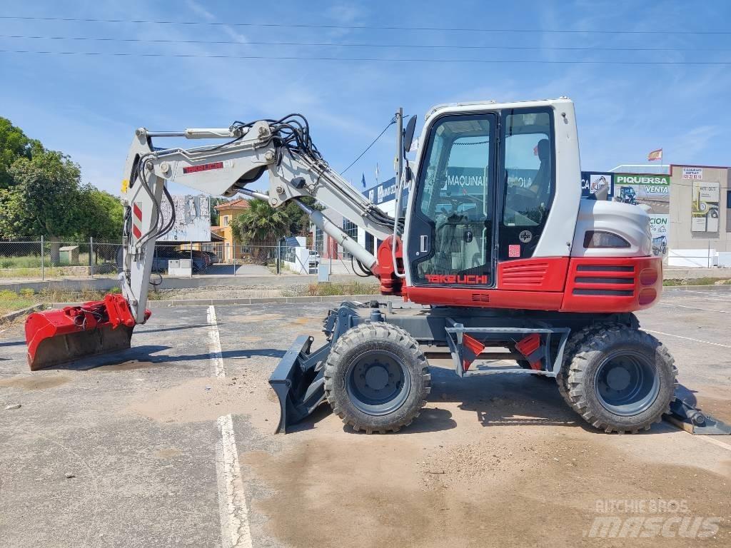 Takeuchi TB 295 W حفارات بعجل