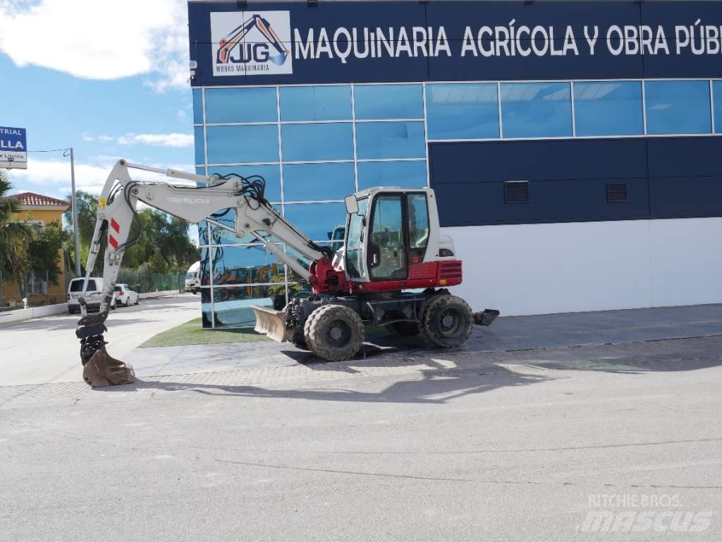 Takeuchi TB 295 W حفارات بعجل