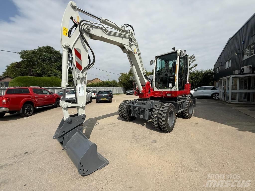 Takeuchi TB 295 W حفارات بعجل