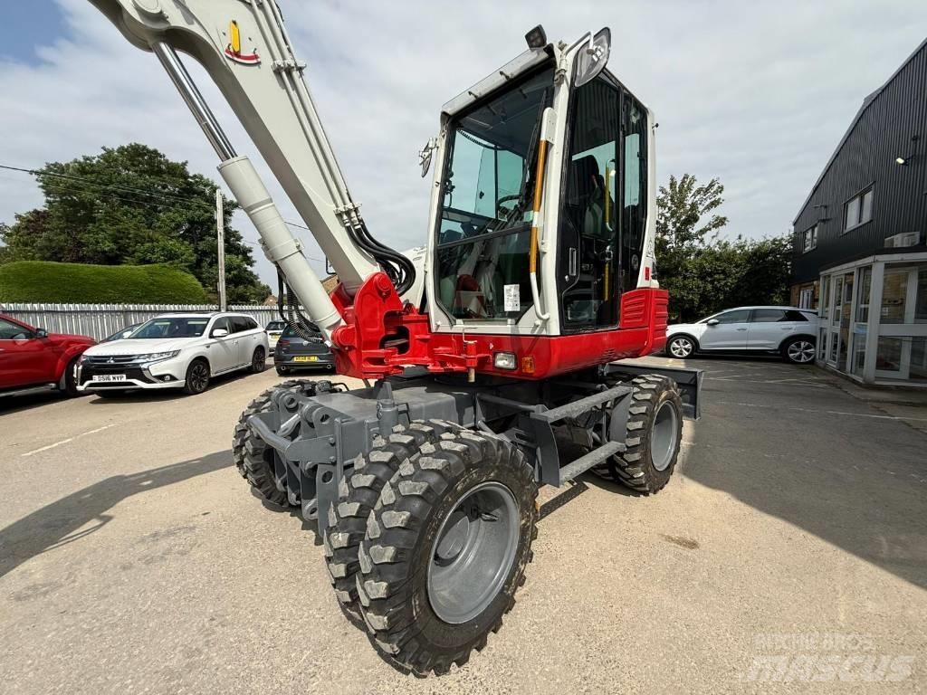Takeuchi TB 295 W حفارات بعجل