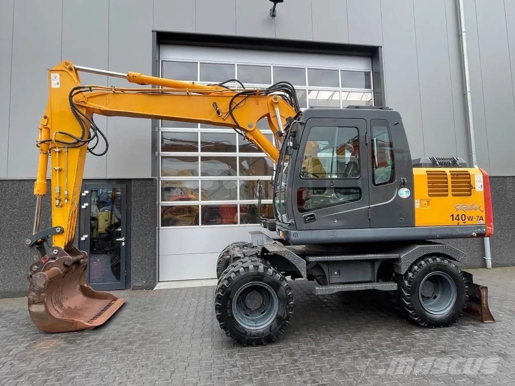 Hyundai R140W-7A حفارات بعجل