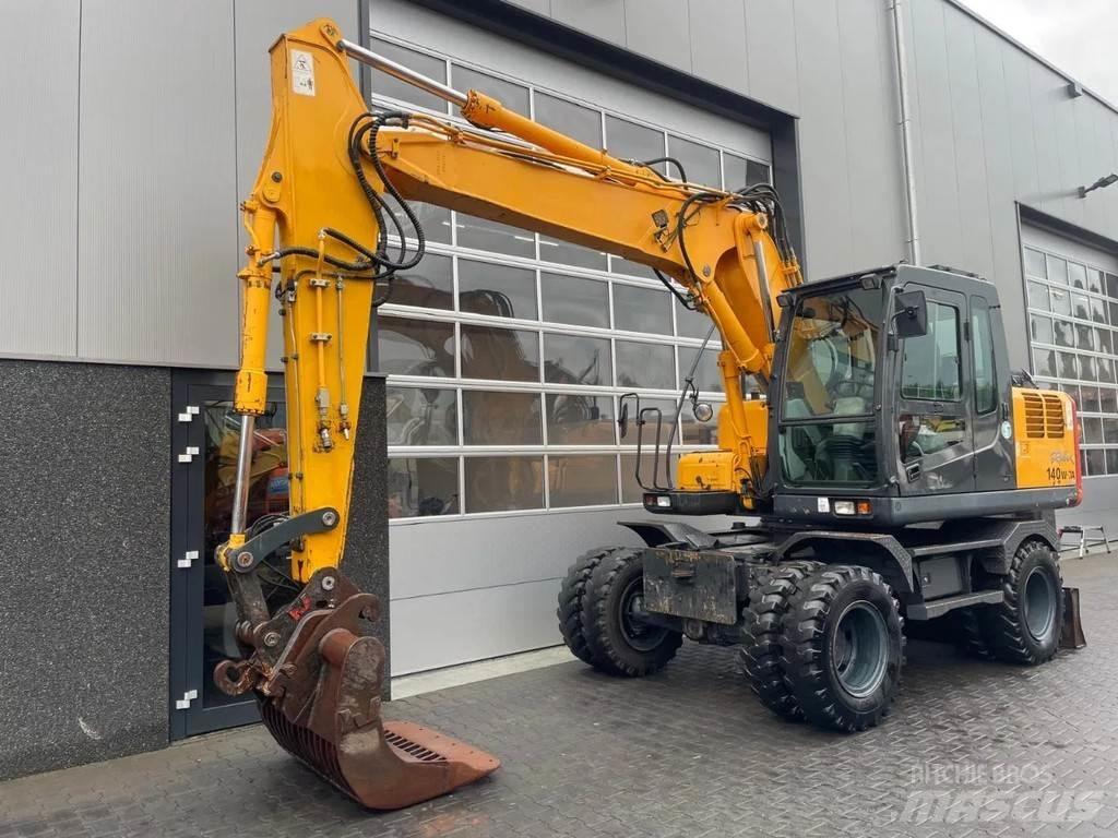Hyundai R140W-7A حفارات بعجل
