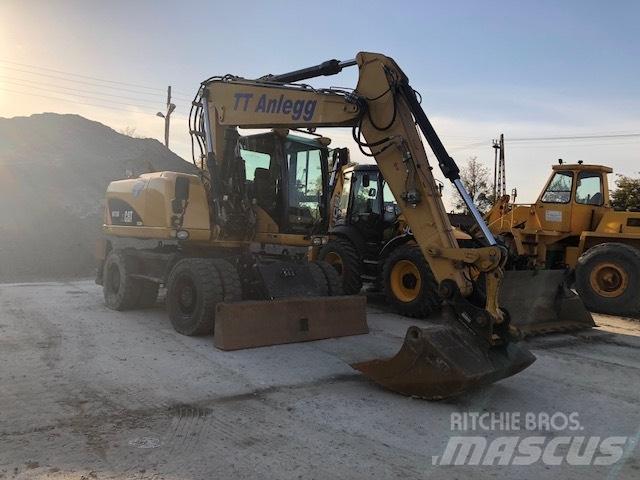 CAT M 315 D حفارات بعجل