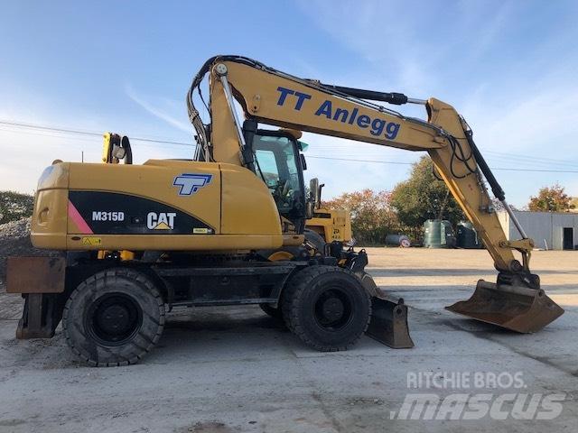 CAT M 315 D حفارات بعجل