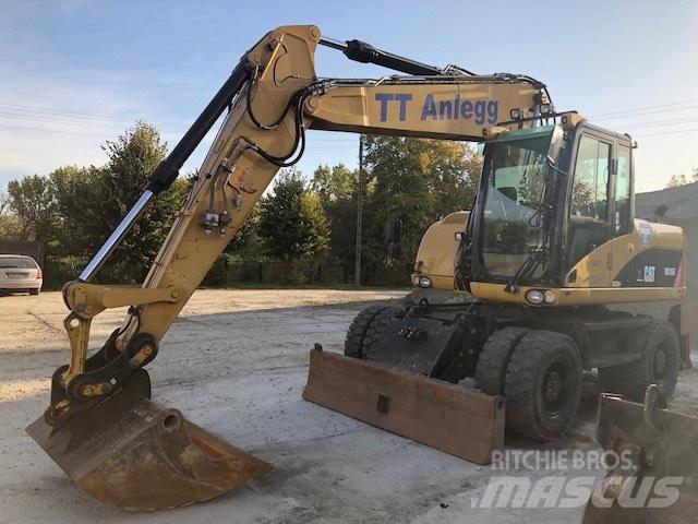CAT M 315 D حفارات بعجل