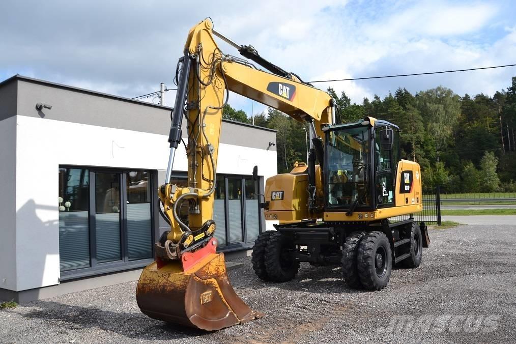 CAT M 314 F حفارات بعجل