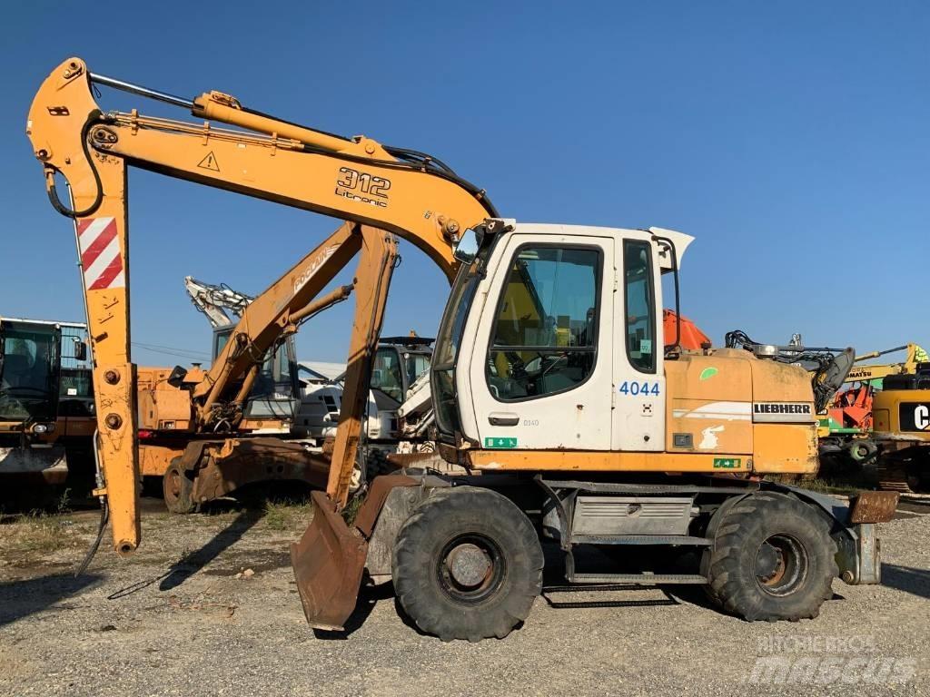 Liebherr A 312 حفارات بعجل