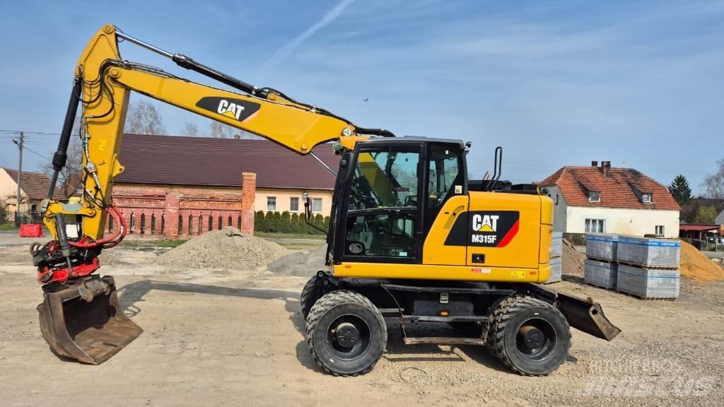 CAT M 315 F حفارات بعجل