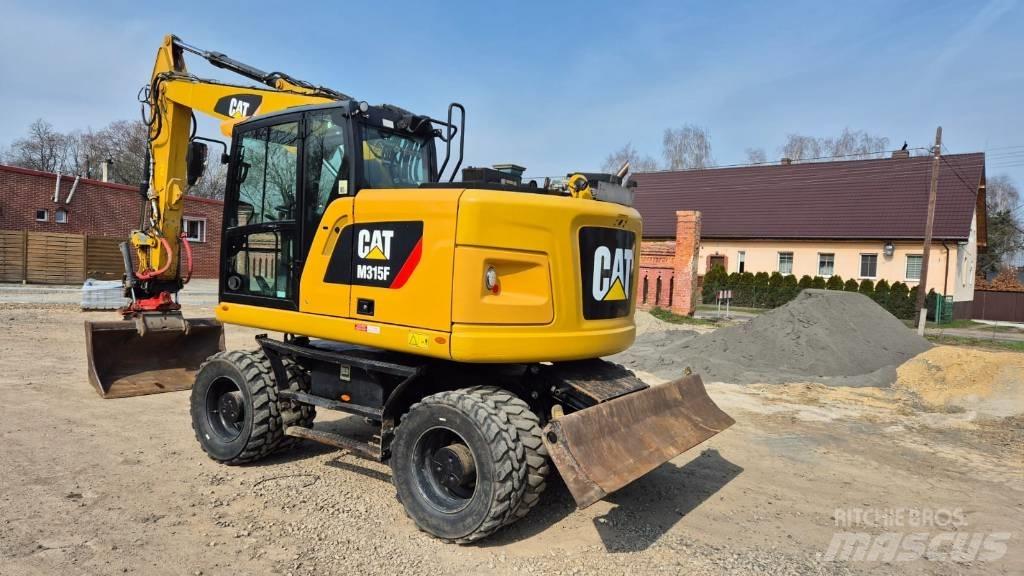 CAT M 315 F حفارات بعجل