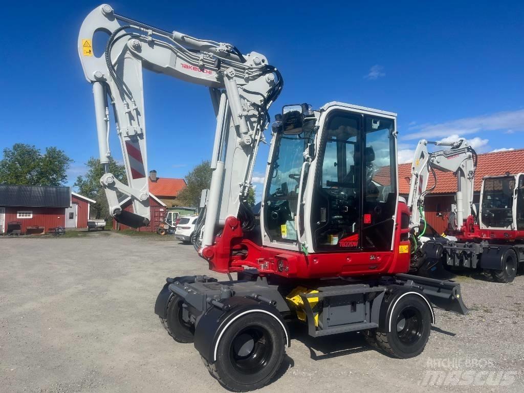 Takeuchi TB 370 W حفارات بعجل