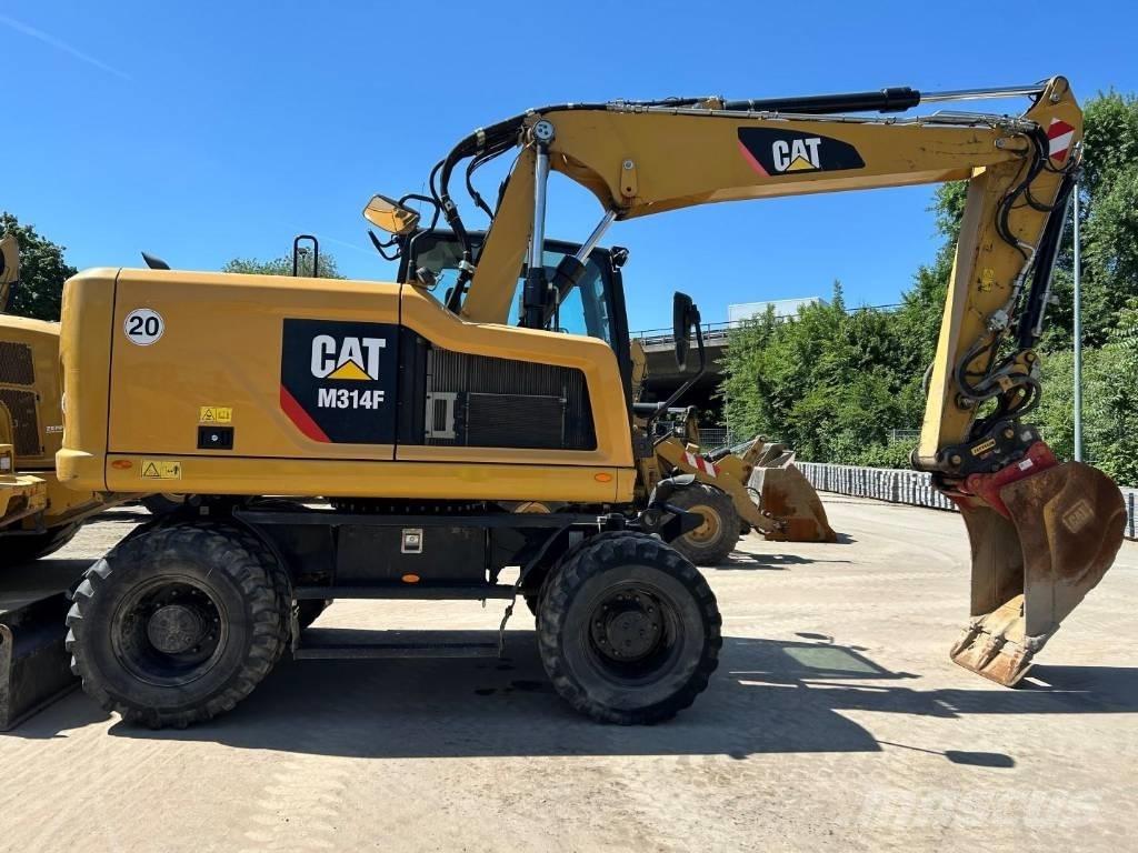 CAT M 314 F حفارات بعجل